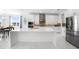 Modern kitchen with white cabinets, large island, and stainless steel appliances at 791 Terrapin Dr, Debary, FL 32713
