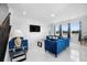 Spacious living room with blue sofas and large windows offering natural light at 791 Terrapin Dr, Debary, FL 32713