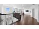 Spacious loft area with hardwood floors and large windows at 791 Terrapin Dr, Debary, FL 32713