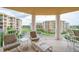 Relaxing balcony with patio furniture and building views at 4670 Links Village Dr # D506, Ponce Inlet, FL 32127