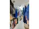 Spacious walk-in closet with ample shelving and hanging space at 4670 Links Village Dr # D506, Ponce Inlet, FL 32127