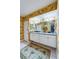 Double vanity bathroom with patterned wallpaper and large mirror at 4670 Links Village Dr # D506, Ponce Inlet, FL 32127