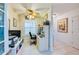 Bright home office with desk, chair, and window with blinds at 4670 Links Village Dr # D506, Ponce Inlet, FL 32127