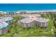 Aerial perspective of a condo building highlighting its location near the beach and golf course at 4670 Links Village Dr # D506, Ponce Inlet, FL 32127