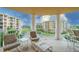 Relaxing balcony with patio furniture and building views at 4670 Links Village Dr # D506, Ponce Inlet, FL 32127