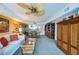 Spacious living room with a sofa, coffee table and large windows at 4670 Links Village Dr # D506, Ponce Inlet, FL 32127