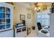 Home office with desk, chair, printer, and built-in shelving at 4670 Links Village Dr # D506, Ponce Inlet, FL 32127