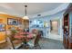 Combined dining and kitchen area with a breakfast bar at 4670 Links Village Dr # D506, Ponce Inlet, FL 32127