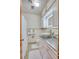 Updated bathroom with a modern vanity and tiled floors at 6269 Se 125Th Pl, Belleview, FL 34420