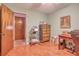 Home office with wood desk and dresser, hardwood floors at 6269 Se 125Th Pl, Belleview, FL 34420