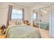 Cozy bedroom featuring a double bed and ample natural light at 6269 Se 125Th Pl, Belleview, FL 34420