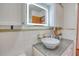 Stylish bathroom featuring a vessel sink and illuminated mirror at 6269 Se 125Th Pl, Belleview, FL 34420