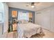 Spacious bedroom with a queen bed and built in shelving at 6269 Se 125Th Pl, Belleview, FL 34420