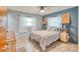 Spacious bedroom with light walls and ceiling fan at 6269 Se 125Th Pl, Belleview, FL 34420