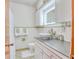 Clean bathroom with updated vanity and a large mirror at 6269 Se 125Th Pl, Belleview, FL 34420