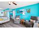 Living room with two armchairs, a sofa and ocean view at 3370 Ocean Shore Blvd # 203B, Ormond Beach, FL 32176
