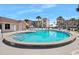 Circular pool with surrounding patio and condo building view at 3370 Ocean Shore Blvd # 203B, Ormond Beach, FL 32176