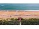 Beach access via boardwalk steps to sandy beach at 3370 Ocean Shore Blvd # 203B, Ormond Beach, FL 32176