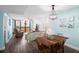 Bright dining area with table and chairs, adjacent to living room at 3370 Ocean Shore Blvd # 203B, Ormond Beach, FL 32176