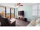 Living room with ocean view, comfy seating and a TV at 3370 Ocean Shore Blvd # 203B, Ormond Beach, FL 32176