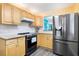 Kitchen with granite countertops and stainless steel appliances at 3370 Ocean Shore Blvd # 203B, Ormond Beach, FL 32176