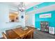 Dining room with a wooden table, chairs, and kitchen view at 3370 Ocean Shore Blvd # 203B, Ormond Beach, FL 32176