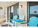 Small balcony with two chairs and a table, ocean view at 3370 Ocean Shore Blvd # 203B, Ormond Beach, FL 32176