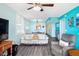 Living room with comfy seating, a large window, and ocean view at 3370 Ocean Shore Blvd # 203B, Ormond Beach, FL 32176