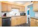 Well-equipped kitchen featuring granite countertops and light wood cabinets at 3370 Ocean Shore Blvd # 203B, Ormond Beach, FL 32176