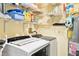 Laundry room with washer, dryer, and built-in shelving at 3370 Ocean Shore Blvd # 203B, Ormond Beach, FL 32176