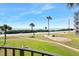 Ocean view from balcony with grassy area and road at 3370 Ocean Shore Blvd # 203B, Ormond Beach, FL 32176