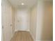 Condo entry with white door and wood-look floors at 231 Riverside Dr # 2409-1, Holly Hill, FL 32117