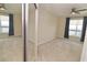 Bright bedroom with mirrored closet and city view at 231 Riverside Dr # 2409-1, Holly Hill, FL 32117