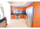 Modern kitchen with stainless steel appliances and wood cabinets at 231 Riverside Dr # 2409-1, Holly Hill, FL 32117