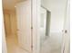 Bedroom with mirrored closet and bathroom entry at 231 Riverside Dr # 2409-1, Holly Hill, FL 32117