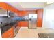 Modern kitchen with stainless steel appliances and granite countertops at 231 Riverside Dr # 2409-1, Holly Hill, FL 32117