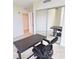 Bedroom with mirrored closet and a standing desk at 231 Riverside Dr # 2409-1, Holly Hill, FL 32117