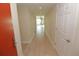 Light condo hallway with wood-look floors at 231 Riverside Dr # 2409-1, Holly Hill, FL 32117