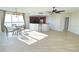 Spacious living room with hardwood floors and kitchen views at 231 Riverside Dr # 2409-1, Holly Hill, FL 32117