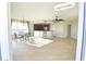 Bright dining area with kitchen access and hardwood floors at 231 Riverside Dr # 2409-1, Holly Hill, FL 32117