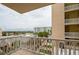 Balcony with partial ocean view and white railings at 3801 S Atlantic Ave # 303, Daytona Beach Shores, FL 32118