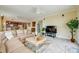 Spacious living room with large sectional sofa and TV at 3801 S Atlantic Ave # 303, Daytona Beach Shores, FL 32118