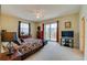 Spacious bedroom with king bed, balcony access, and ocean view at 3801 S Atlantic Ave # 303, Daytona Beach Shores, FL 32118