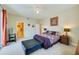 King-size bed, en-suite bathroom access, and balcony access at 3801 S Atlantic Ave # 303, Daytona Beach Shores, FL 32118