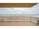 Balcony with full ocean view and white railings at 3801 S Atlantic Ave # 303, Daytona Beach Shores, FL 32118