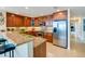 Modern kitchen with granite countertops and stainless steel appliances at 3801 S Atlantic Ave # 303, Daytona Beach Shores, FL 32118