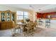 Formal dining room with hardwood floors and access to kitchen at 3801 S Atlantic Ave # 303, Daytona Beach Shores, FL 32118