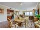 Elegant dining room with large windows and hardwood floors at 3801 S Atlantic Ave # 303, Daytona Beach Shores, FL 32118