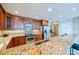 Modern kitchen with granite countertops and stainless steel appliances at 3801 S Atlantic Ave # 303, Daytona Beach Shores, FL 32118