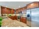Modern kitchen with granite countertops and stainless steel appliances at 3801 S Atlantic Ave # 303, Daytona Beach Shores, FL 32118